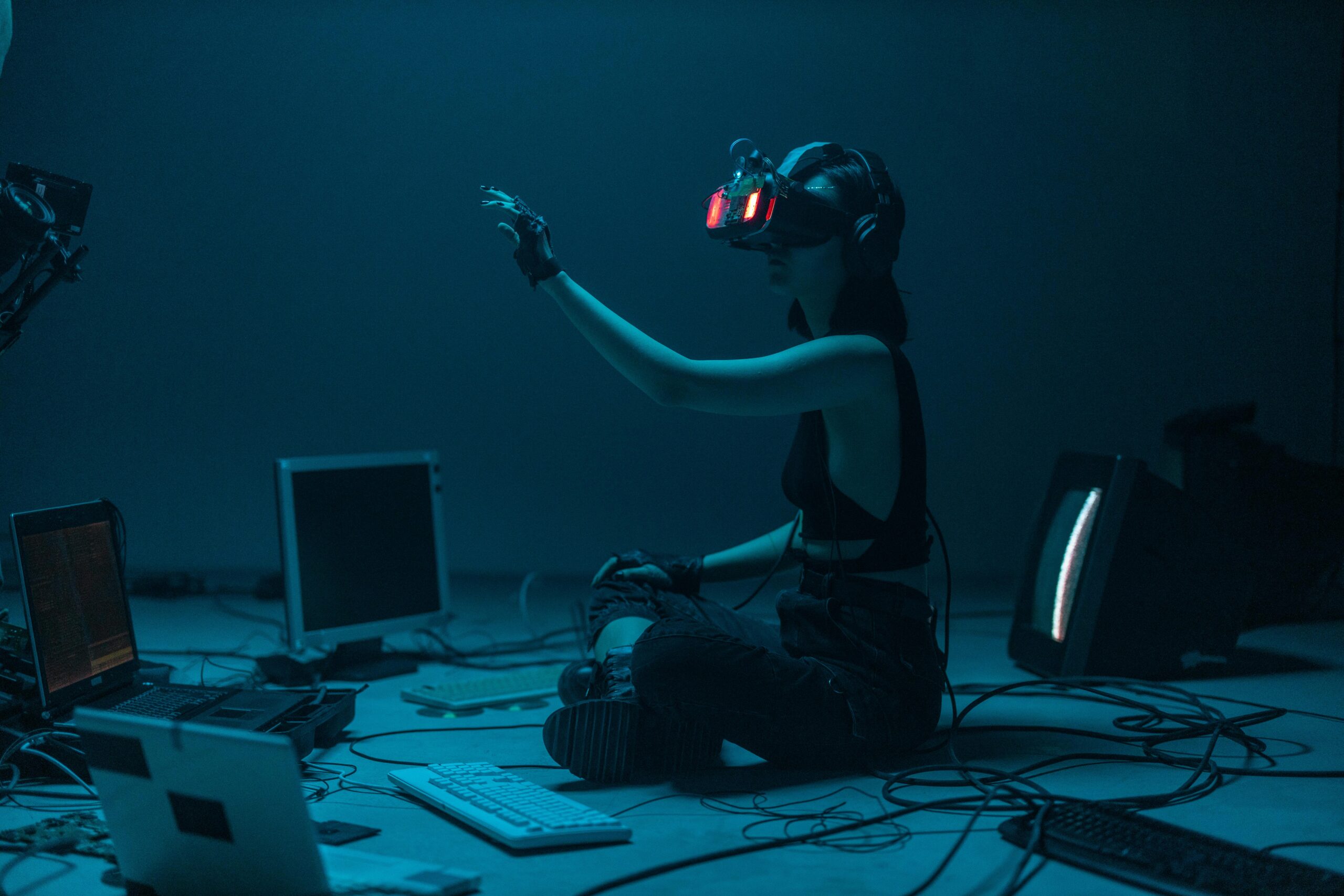 A person using VR headset and AI technology setup representing the future of artificial intelligence in 2025